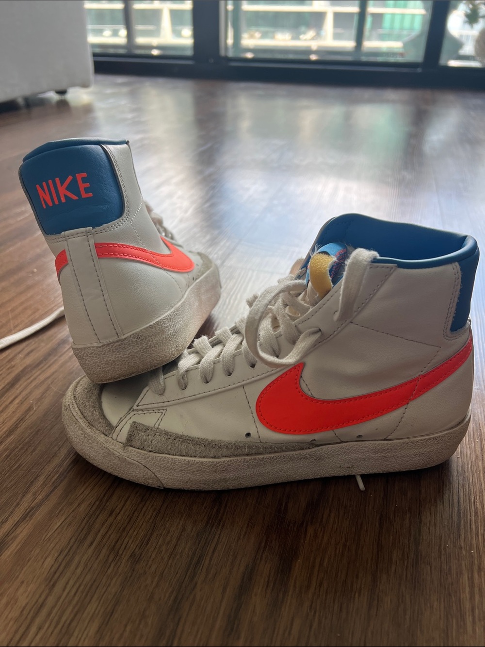 Nike White High-Top Sneakers with Bright Orange Swoosh and Blue Collar- Knicks